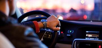 Driver using map navigation in car